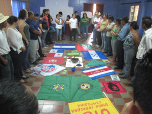 flags and attendees at Central America Peasant School