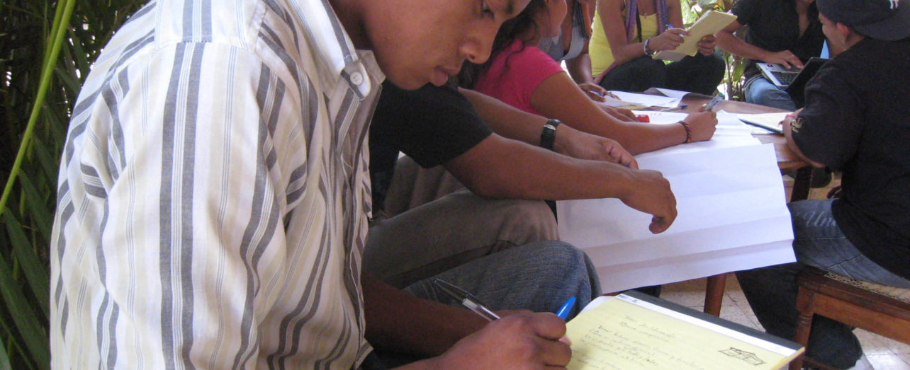 People taking notes at Central America Peasant School