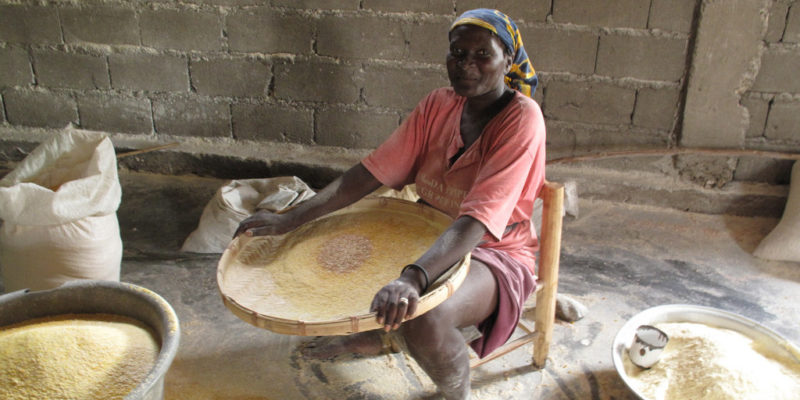 Woman with maise, Haiti.