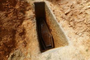 Image of coffin in grave